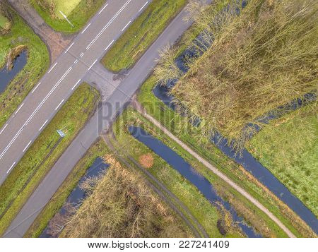 Multi Traffic Crossing Of Cycling Track, Walking Track, Road And Canals In Lowland Countryside In Th