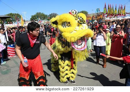 Costa Mesa CA. - 2/17/18 TET Festival featuring a Lion Dance in which performers mimic a lion's movements in a lion costume to bring good luck and fortune.