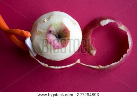 Cleared Apple On A Red Background