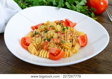 Warm Salad With Seafood In A White Bowl On A Wooden Background. Pasta Radiatori With Crayfish, Shrim