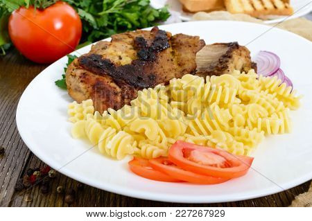 Pasta Radiatori And Fried Rabbit Ribs. Close Up