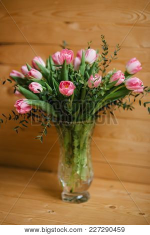 A Bouquet Of Pink Tulips In A Beautiful Crystal Vase.