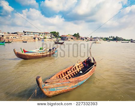 View of the river, fishing boats on the foreground. Sittwe, Myanmar