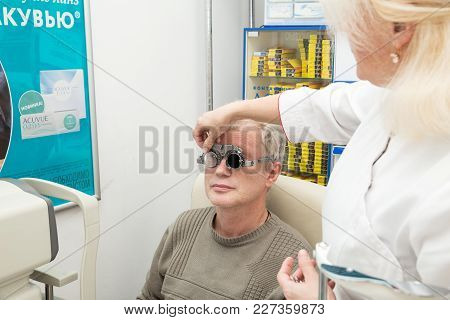 Saint Petersburg, Russia - February 13, 2018: A Mature Man Visits An Ophthalmologist. Diopter Select