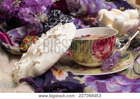 Cup Of Berry Tea With Delicious White Merengue On The Violet Shawl. Sweet Morning With Tea.