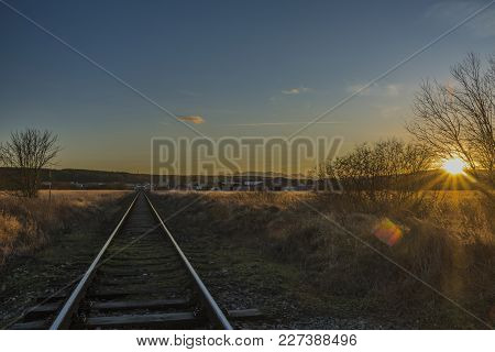 Sunset Near Ceske Budejovice City In Winter Evening With Railway