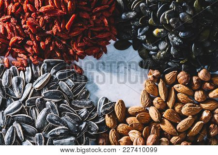 A mix of Brasilian nuts, almonds, pumpkin seeds, dried goji berries and sunflower seeds. Healthy snacks. Copyspace