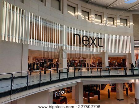 MANCHESTER - FEBRUARY 20, 2018: Next, a British multinational clothing, footwear and home products retailer at The Manchester Arndale shopping centre in Manchester, England, UK.