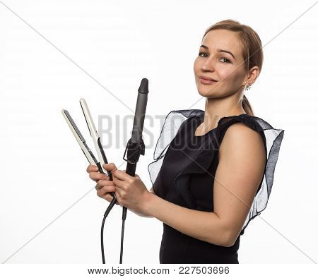 Female Professional Hairdresser With Ploy. Elegant Woman Presents Her Hairdresser's Accessories. Hai