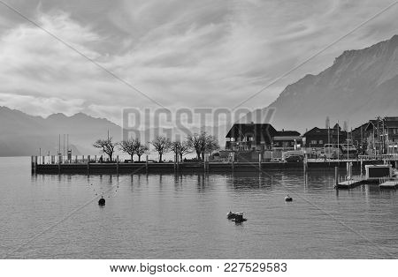 Scene In Brienz, Switzerland. Lake Brienzersee And Mount Augstmatthorn. Quai.