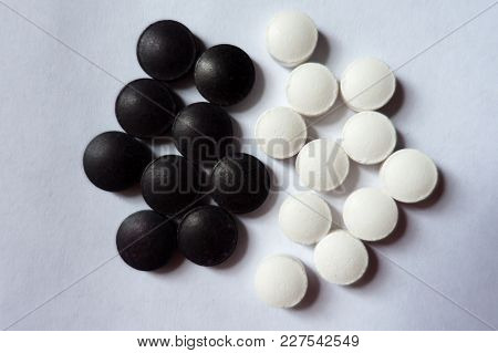 Closeup Of Black And White Tablets From Above