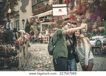 September 2017, Belgrade Serbia: Skadarlija Street, Foreign Tourists Taking A Selfie Picture, Three 