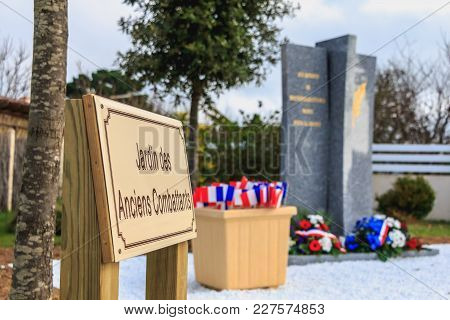 Sign Indicating Veterans Garden In French At The Entrance Of A Monument