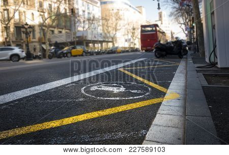 Charging Station In Barcelona, Passeig De Gracia, And Sign On The Street Pavement. Electric Car, Sus