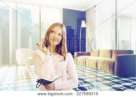 Woman With A Planner In A Brown Sofa With A Round Coffee Table And A White Armchair Living Room Corn