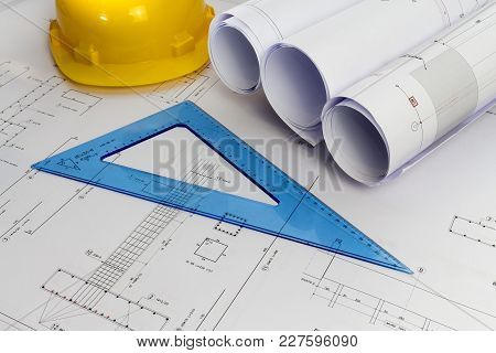 Building Design: Office Desk With Project Drawings