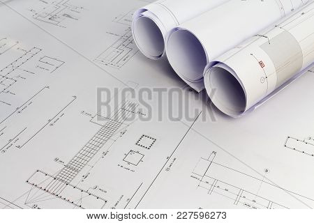 Building Design: Office Desk With Project Drawings