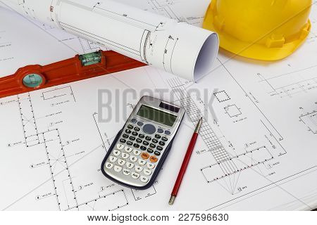 Building Design: Office Desk With Project Drawings