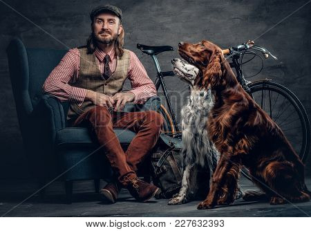 A Stylish Irland Hipster Man Posing With Single Speed Bicycle And Irish Setter Dog.