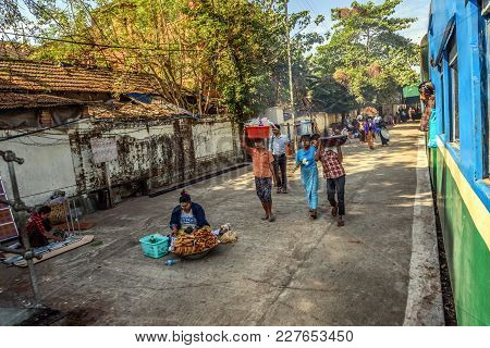 Yangon, Myanmar - January 19, 2016 :  Passengers Getting Off  The Local Circle Train In Yangon. Yang