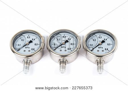Close-up The Group Of Three New Vibration-resistant Manometer Filled With Glycerin. Manometers On Is