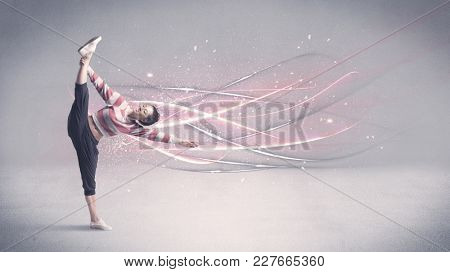 A pretty hip hop dancer dancing contemporary dance illustrated with glowing motion lines in the background concept.