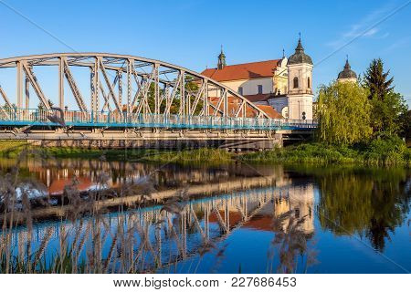 View At Bridge Over The Narew River And Baroque Church Of The Holy Trinity In Tykocin Town, Podlasie