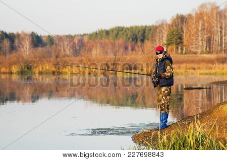 Woman Catches A Fish On Spinning