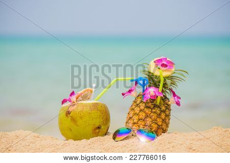 Purple Orchid Flower Put On Fresh Pineapple Juice And Sliced Pineapple Fruit With Coconut Drink And 
