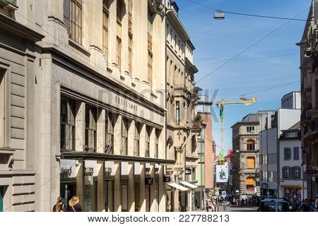 BASEL, SWITZERLAND - June 16, 2017: Tourists on foot Graben Street in Basel,Switzerland