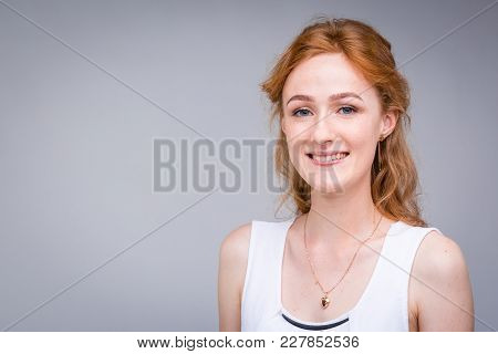 Closeup Portrait Young, Beautiful Business Woman, Student With Lred, Curly Hair And Freckles On Face