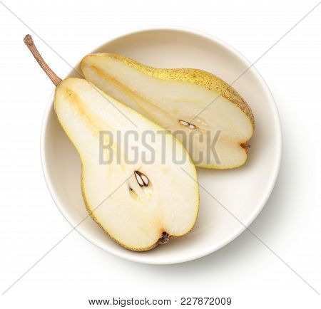 Pear In Bowl Isolated On White Background. Abate Fetel Pear. Top View