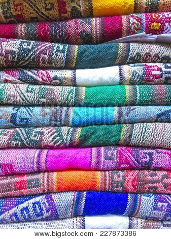 Andean Blankets In A Street Market, La Paz, Bolivia. The Photo Works As A Background. Andean Culture