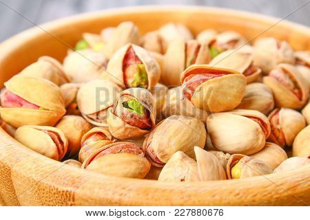 Dish Full Of Pistachios With More Pistachios On Side