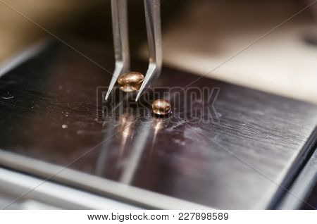 The Work Of Jewelers. The Jeweler Weighs The Copper Granules On A Digital Scale. Selective Focus. Ma