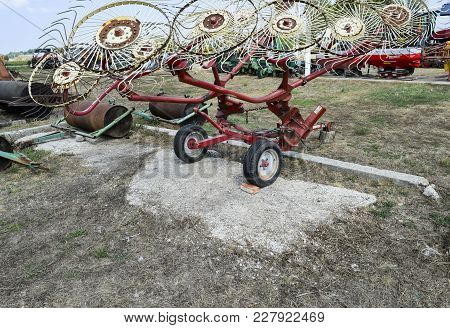 Tedder On Trailer For Tractor. The Machine For Gathering Hay.