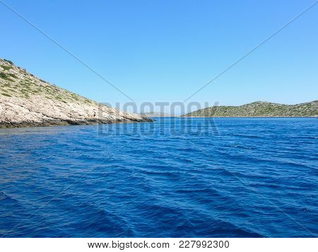 Sea Surface Aerial View. Background Shot Of Clear Sea Water Surface. Blue Sea Water In Calm. Sea Tex