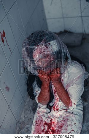 Horror Scence Of Woman Cover The Plastic Bag In Head In Toilet
 At Abandoned House.ghost Women Wear 