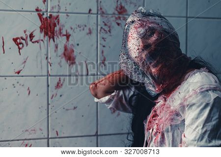 Horror Scence Of Woman Cover The Plastic Bag In Head In Toilet
 At Abandoned House.ghost Women Wear 