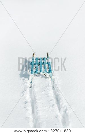 Blue Sledge Or Sleigh With Sledging Tracks On The Deep Snow, Copyspace, Concept Winter Season And Fu