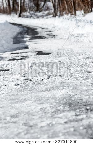 Black Ice And Snow On The Country Road Or Street, Danger And Accident Risk At The Winter Season, Cop