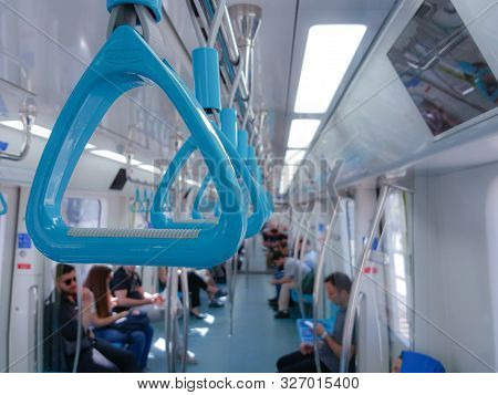 Istanbul, Turkey - June 24, 2019: Passengers And Blue Handholds In Marmaray Commuter Rail. Marmaray 