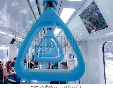 Istanbul, Turkey - June 24, 2019: Passengers And Blue Handholds In Marmaray Commuter Rail. Marmaray 