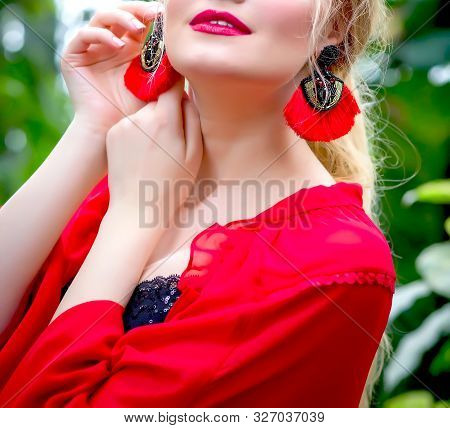 Pregnant Blonde Girl In A Red Tunic And With Earrings In The Tropics Walks