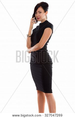 Studio Shot Of Young Beautiful Businesswoman Standing While Touc