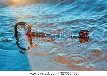 An Old Lost Key In The Sand Is A Newfound Opportunity. The Concept Of Success, Luck And Unexpected W