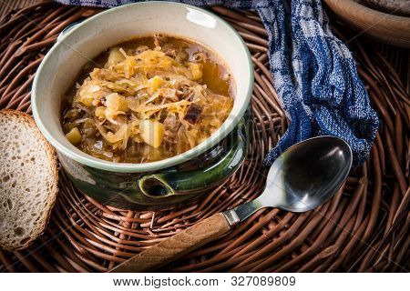 Traditional Russian Sour Cabbage Soup On Wicker Napkin.