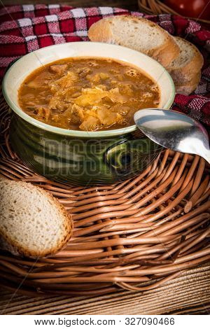 Traditional Russian Sour Cabbage Soup On Wicker Napkin.