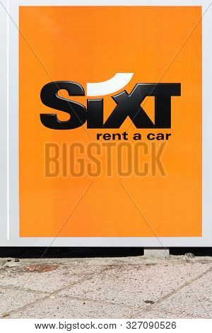 Aarhus, Denmark - August 25, 2019: Sixt Logo On A Wall. Sixt Is A European Multinational Car Rental 