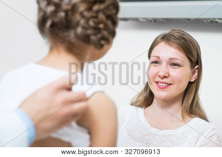 Doctor Examining Teen Girl Doctor Examining Teen Girl